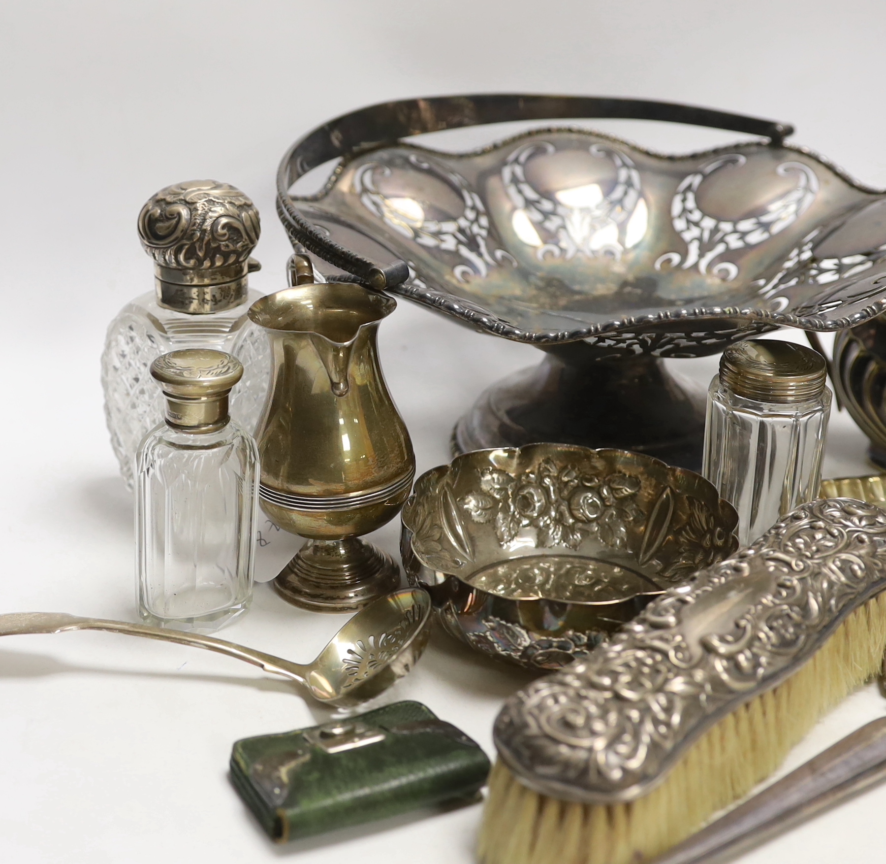 Small silver items including a pair of silver mounted cut glass scent bottles small bowl, toilet jars, mirror, brushes, cigarette case, stamp case, cream jug etc. and two plated items.